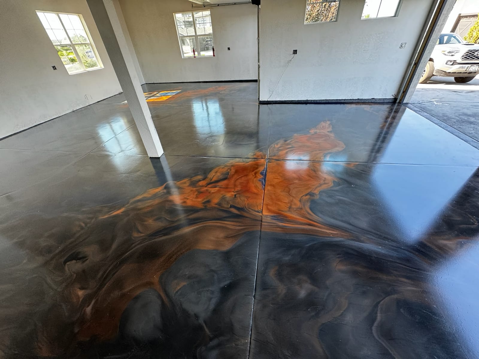 Metallic artistry, an orange and black lava epoxy floor